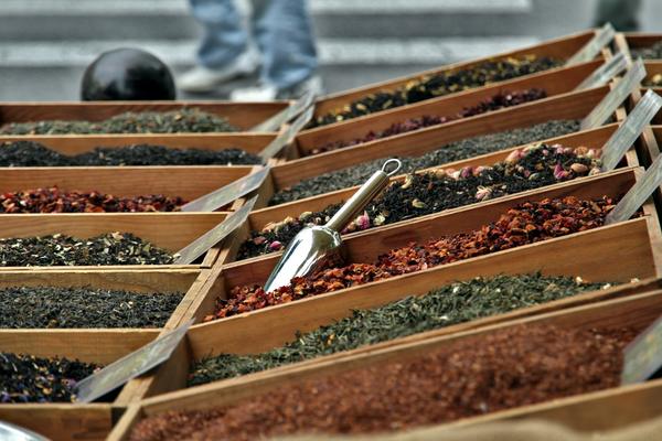 Bins of loose tea and spices